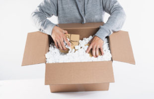 some-packages-being-placed-into-packing-materials